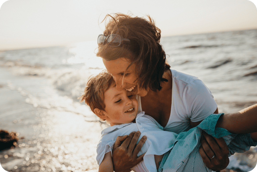 Mother and young son at the beach